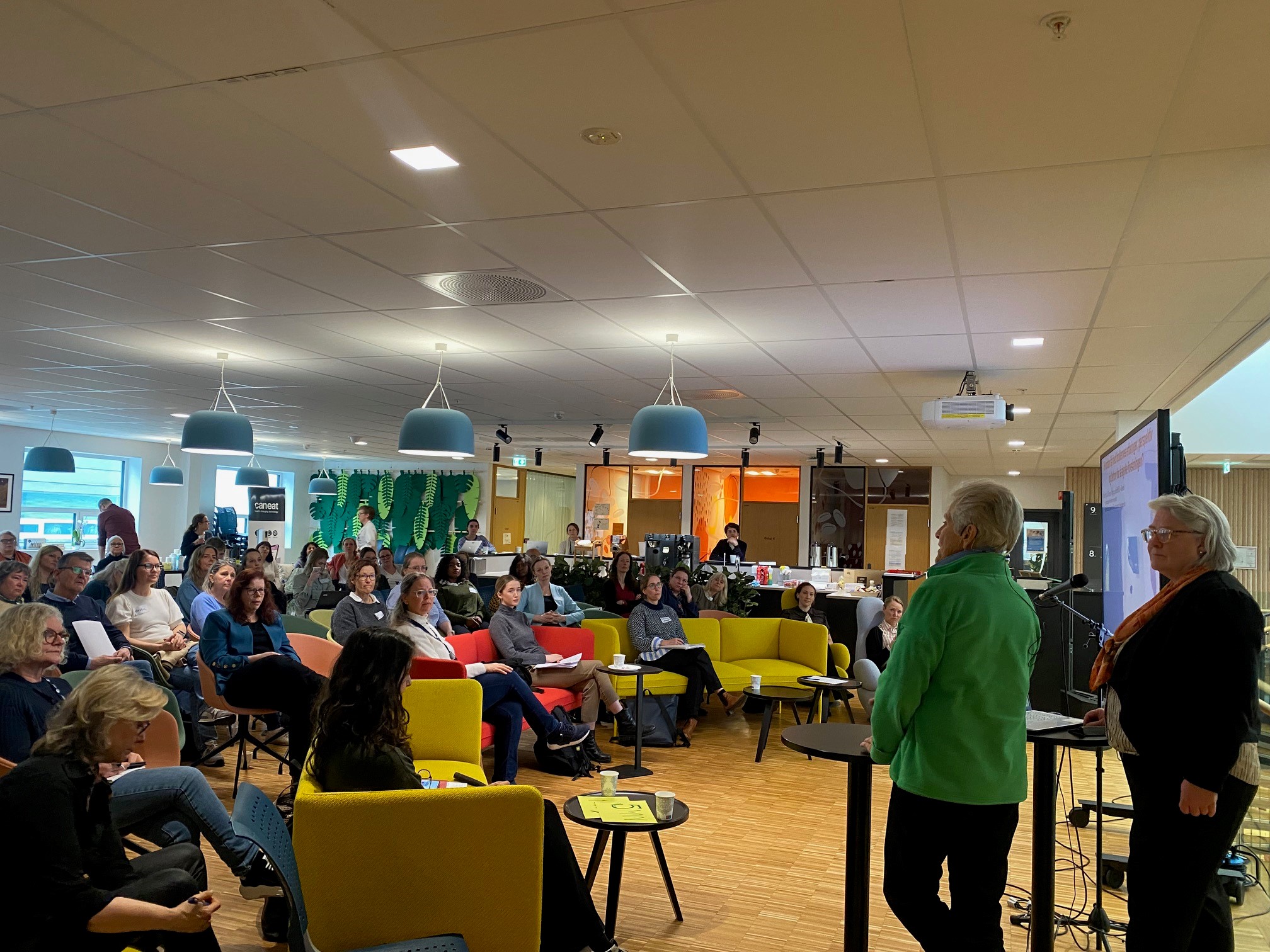 A group of people sitting in a room