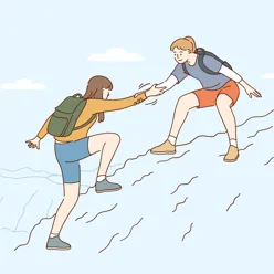 Jente som strekker ut en hånd for å hjelpe en annen jente opp et fjell