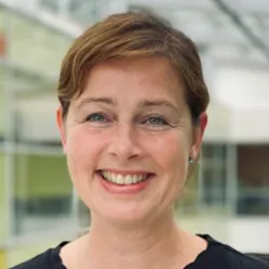 A close-up of a woman smiling