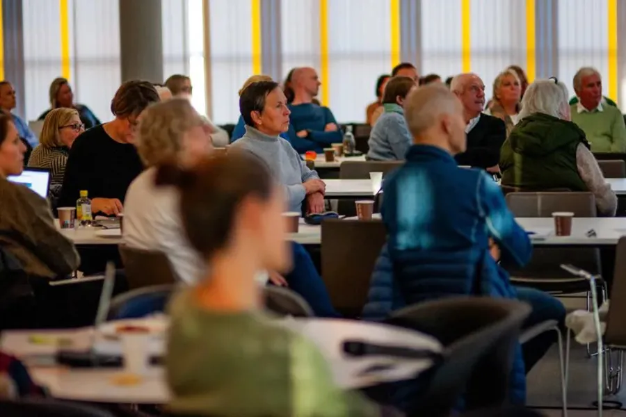 A group of people sitting at tables