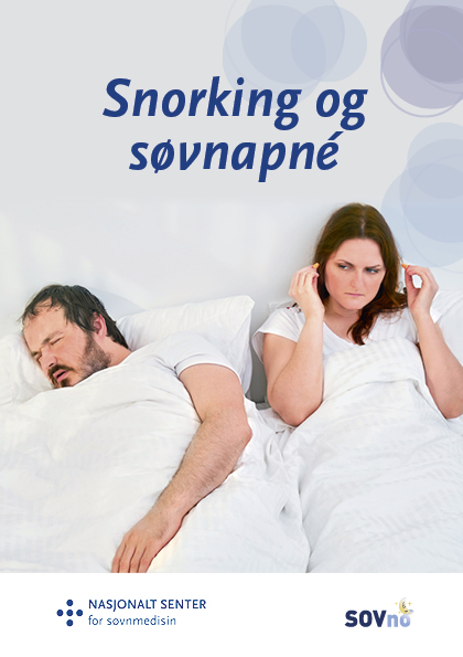 A man and woman lying in bed