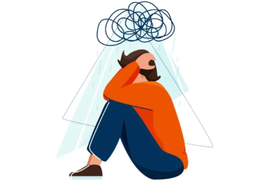 En person som holder seg for hodet