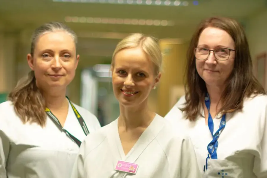 A group of women in white lab coats