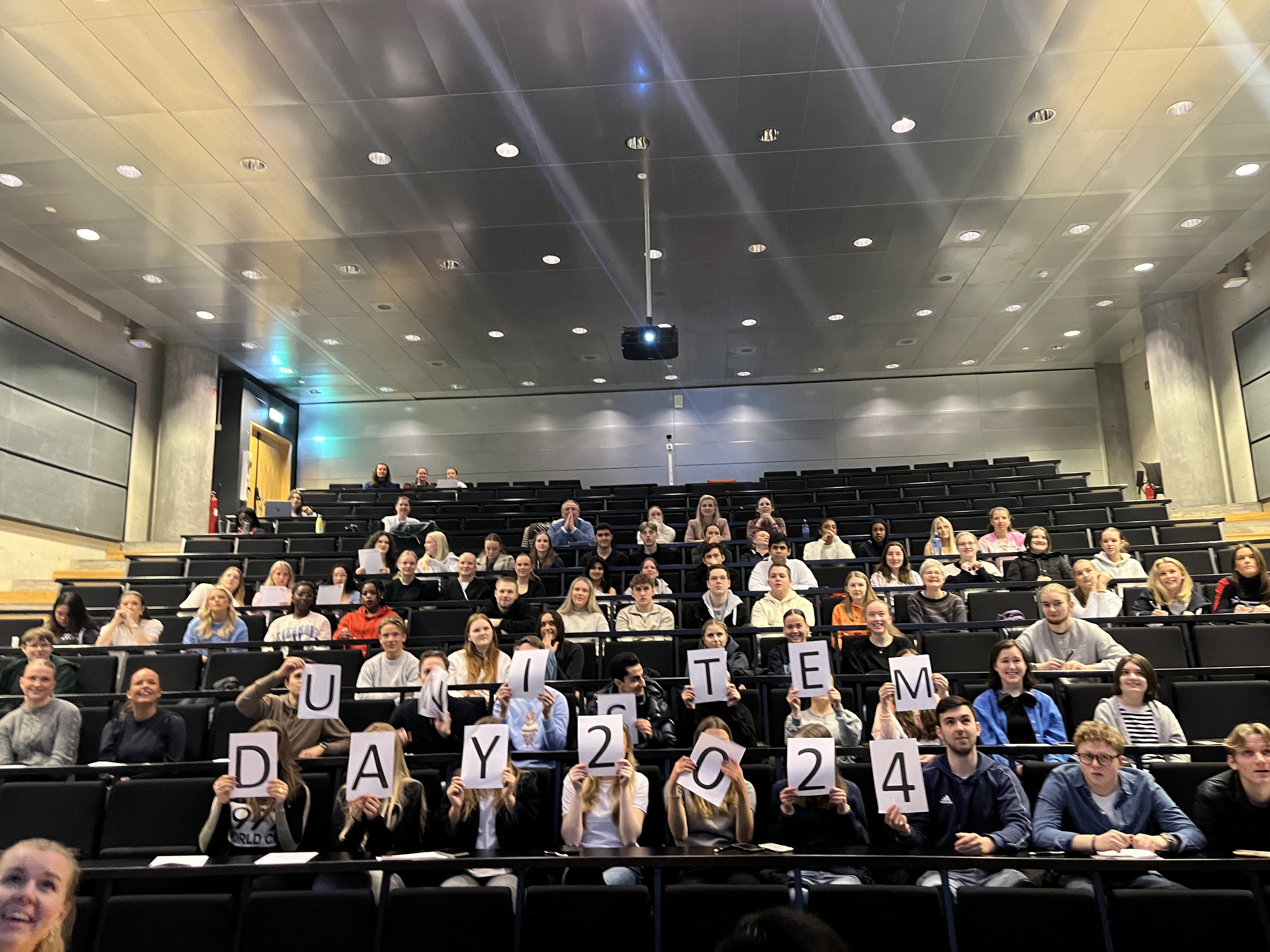 A group of people sitting in a room