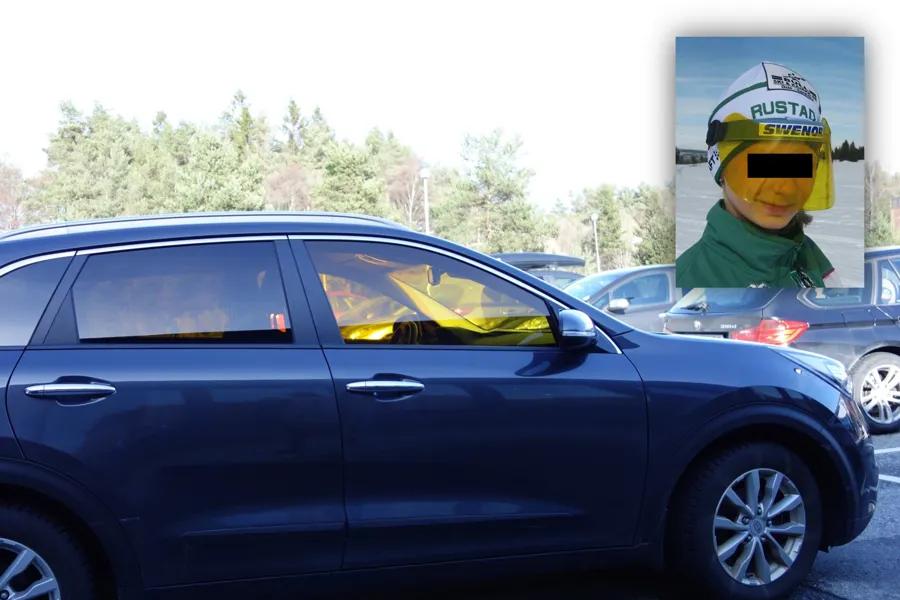 A car with a person in a garment on top of it