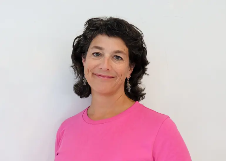 A person in a pink shirt