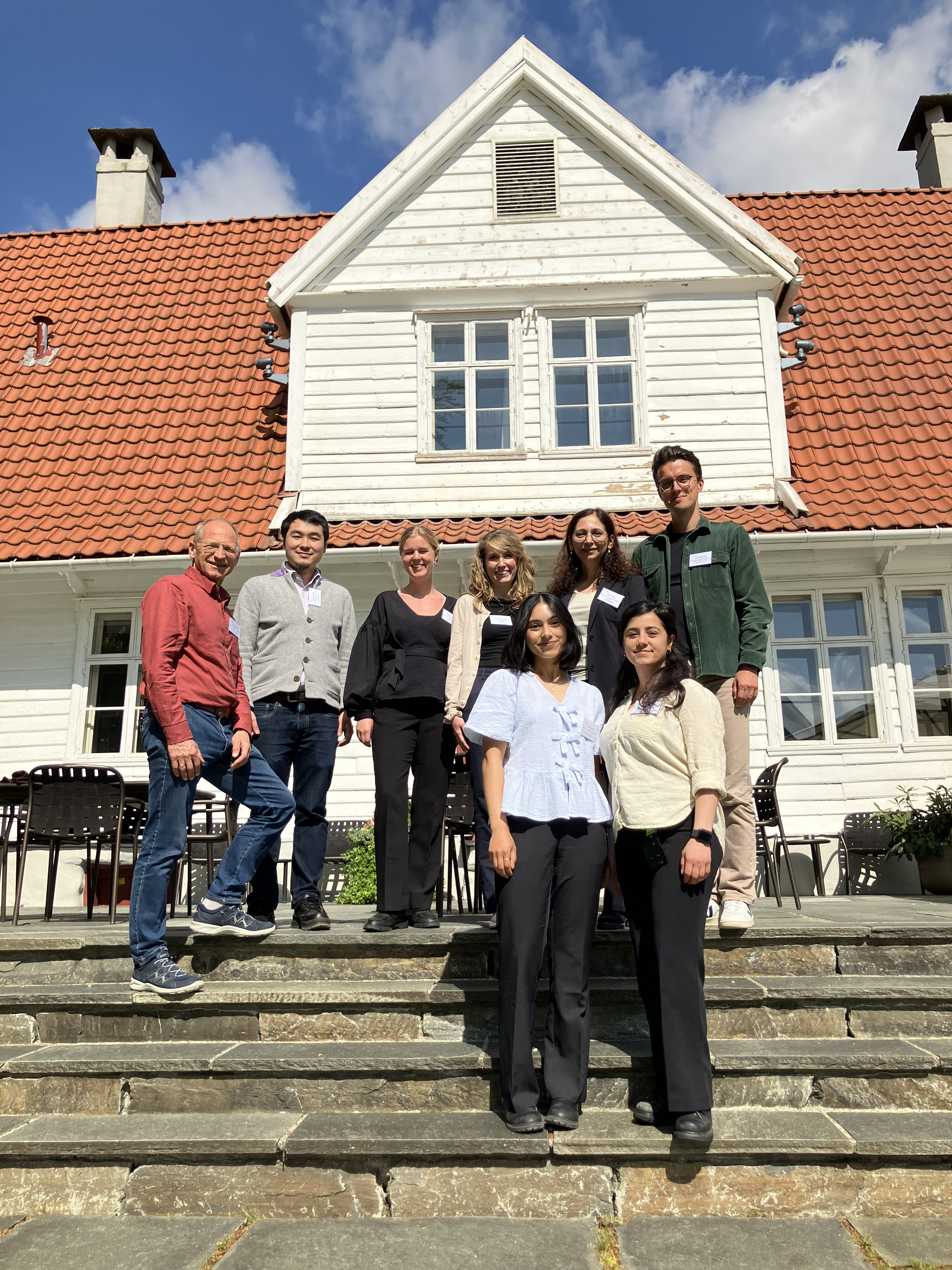 A group of people posing for a photo on some steps