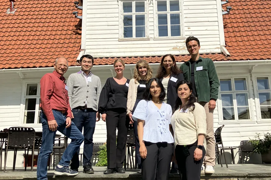 A group of people posing for a photo on some steps
