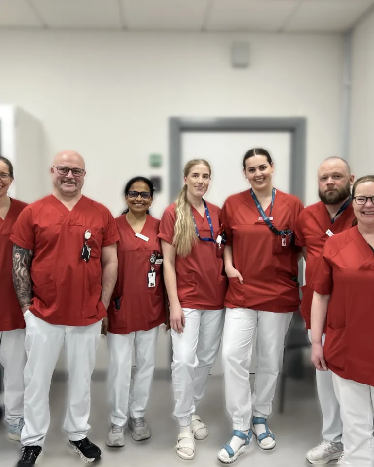 A group of people wearing red shirts
