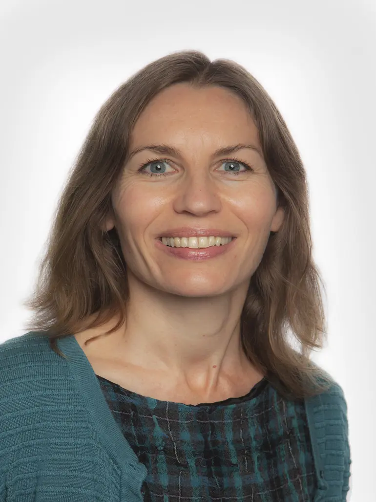 A close-up of a woman smiling