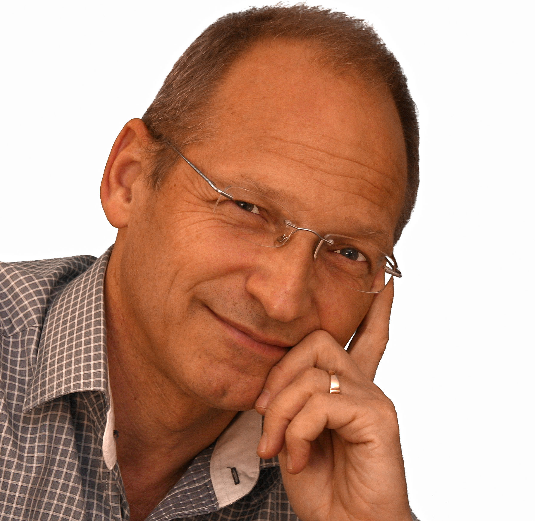 A man with his hand on his face