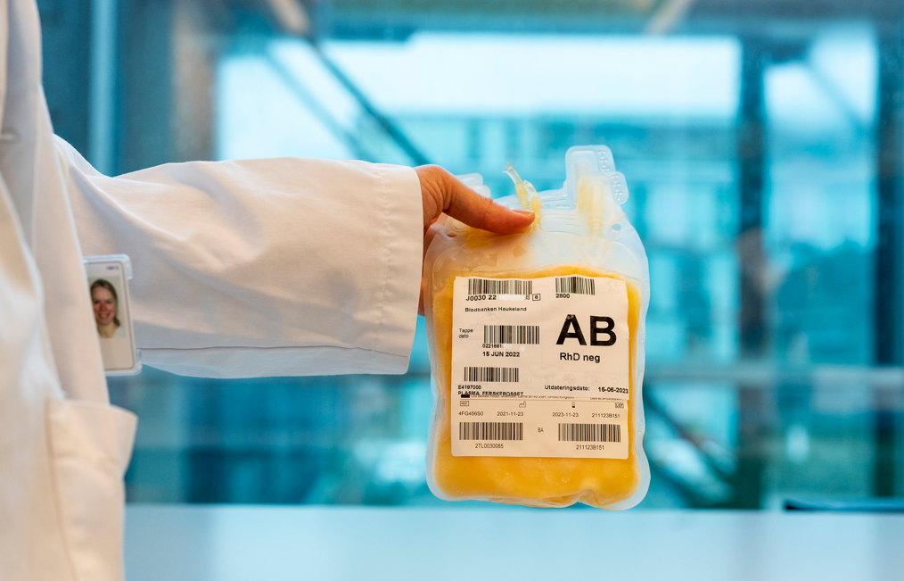 A person holding a bottle