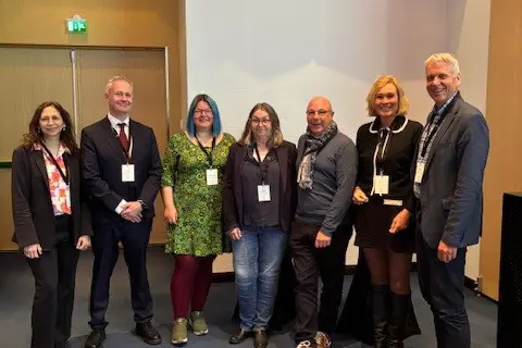 A group of people posing for a photo