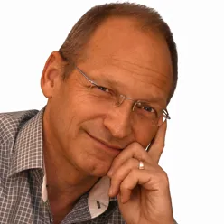 A man with his hand on his face