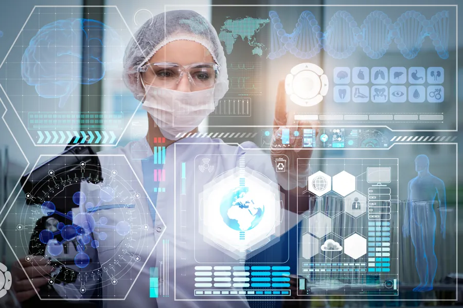 Image of scientist with protective mask, hair net and glasses looking at a futuristic screen