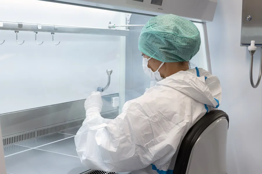 A person in a white lab coat