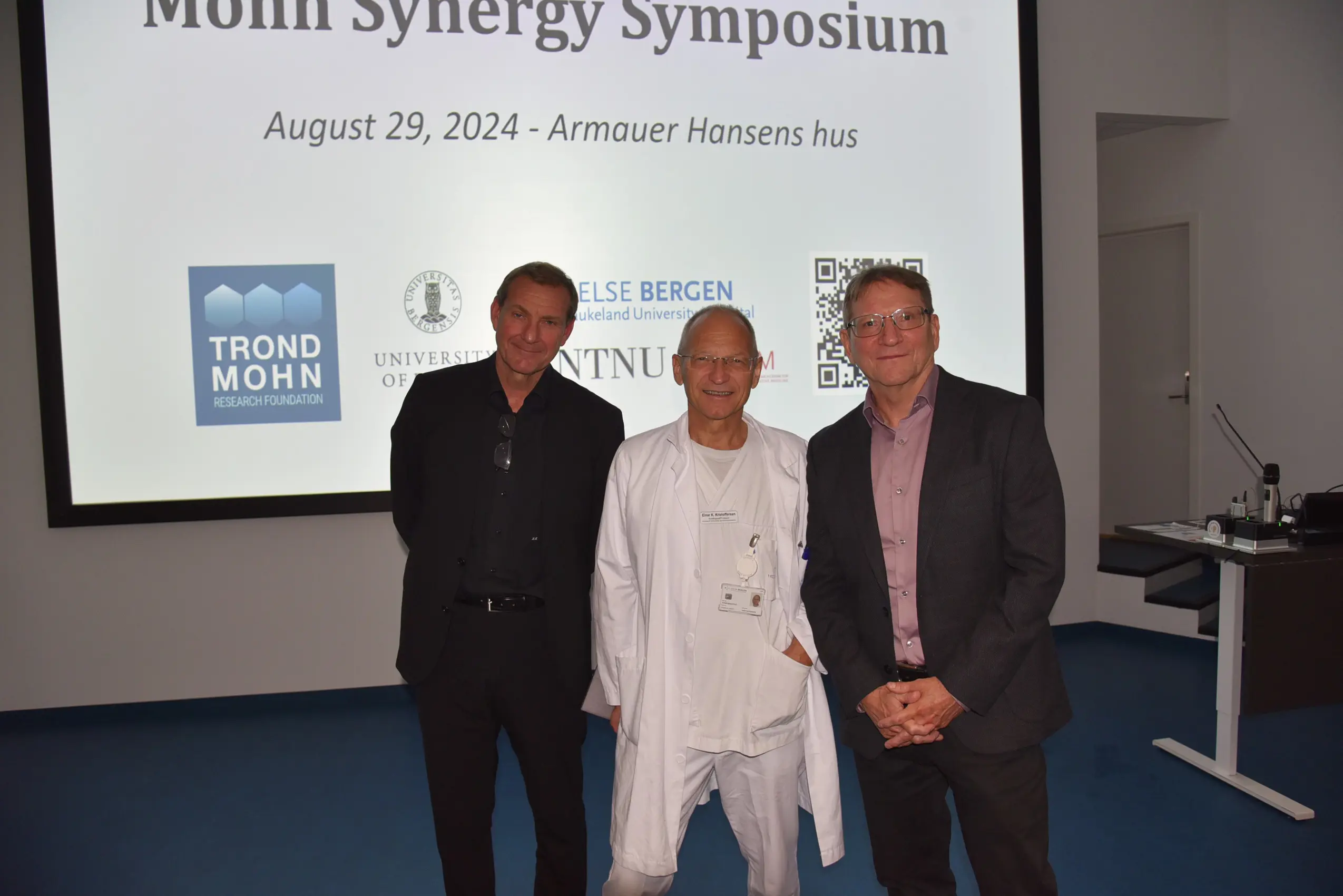 A group of men posing for a photo