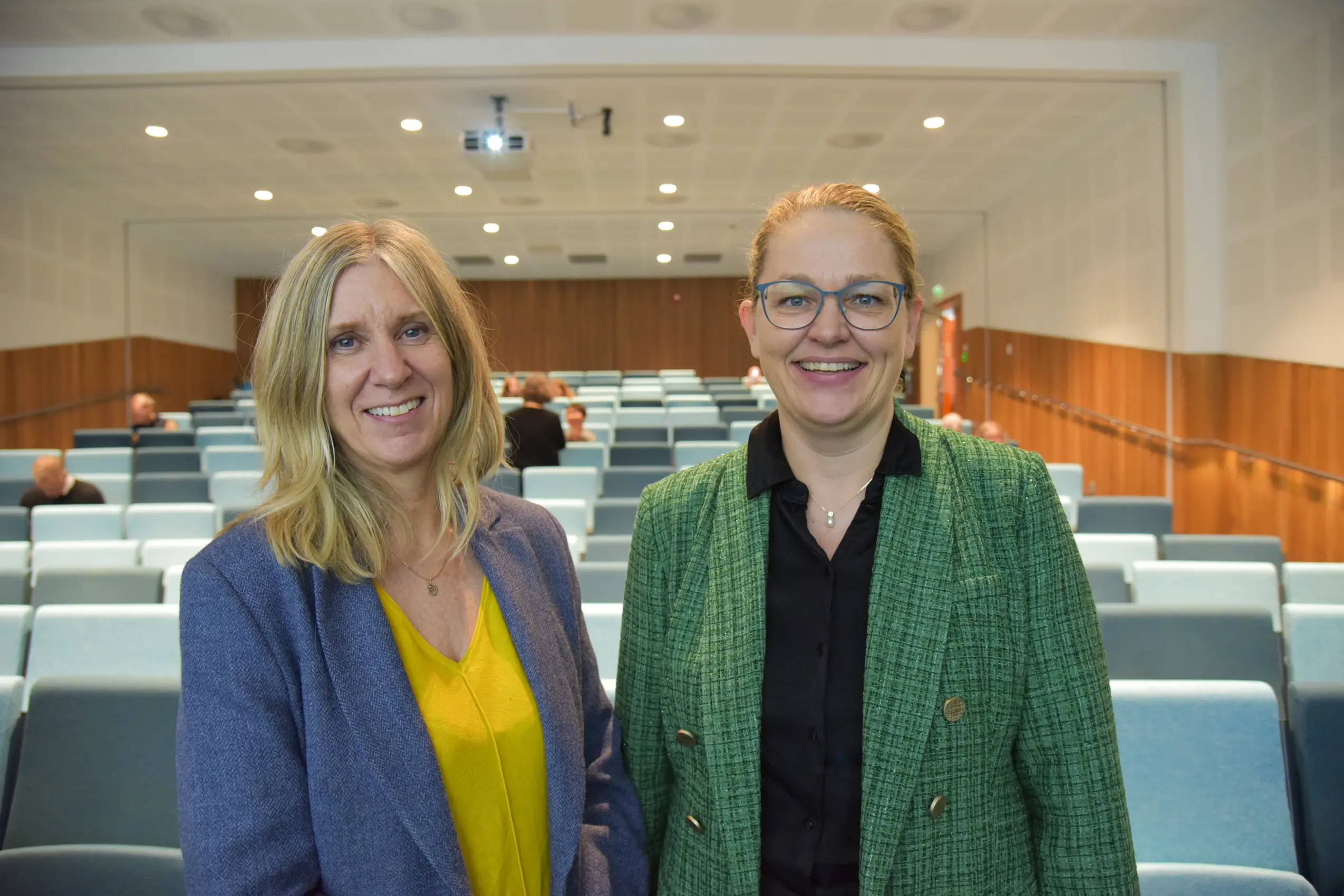 A couple of women smiling
