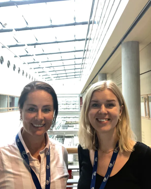 A man and a woman smiling