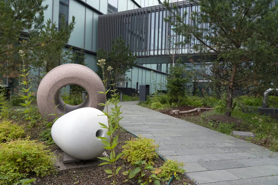 A garden with large white sculptures