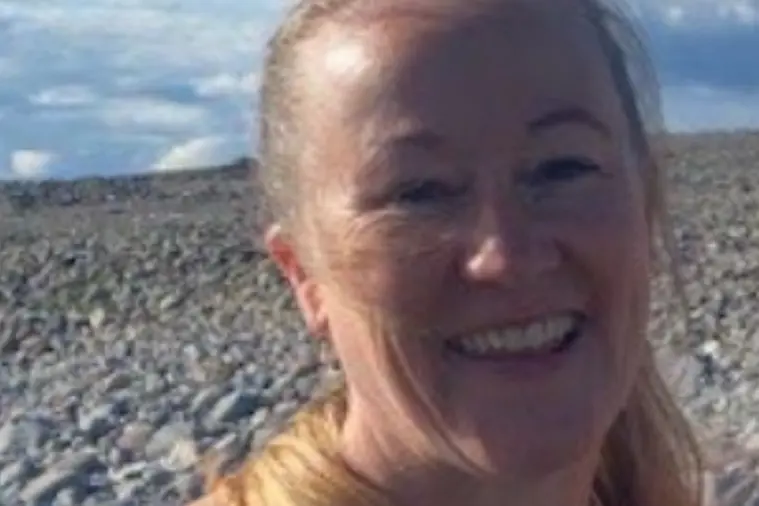 A woman smiling at the camera