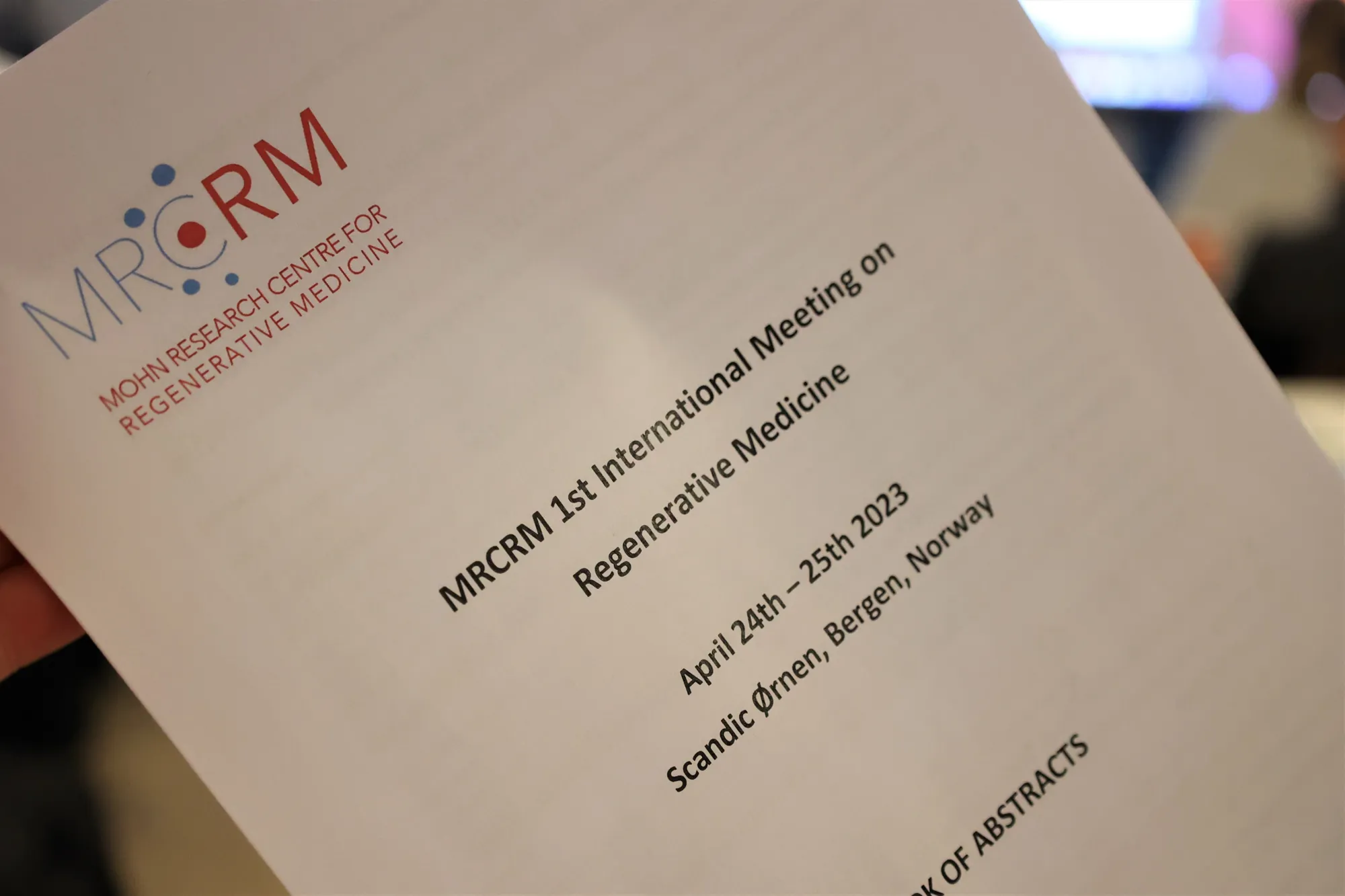 Front page of conference program with MRCRM logo. Photo.