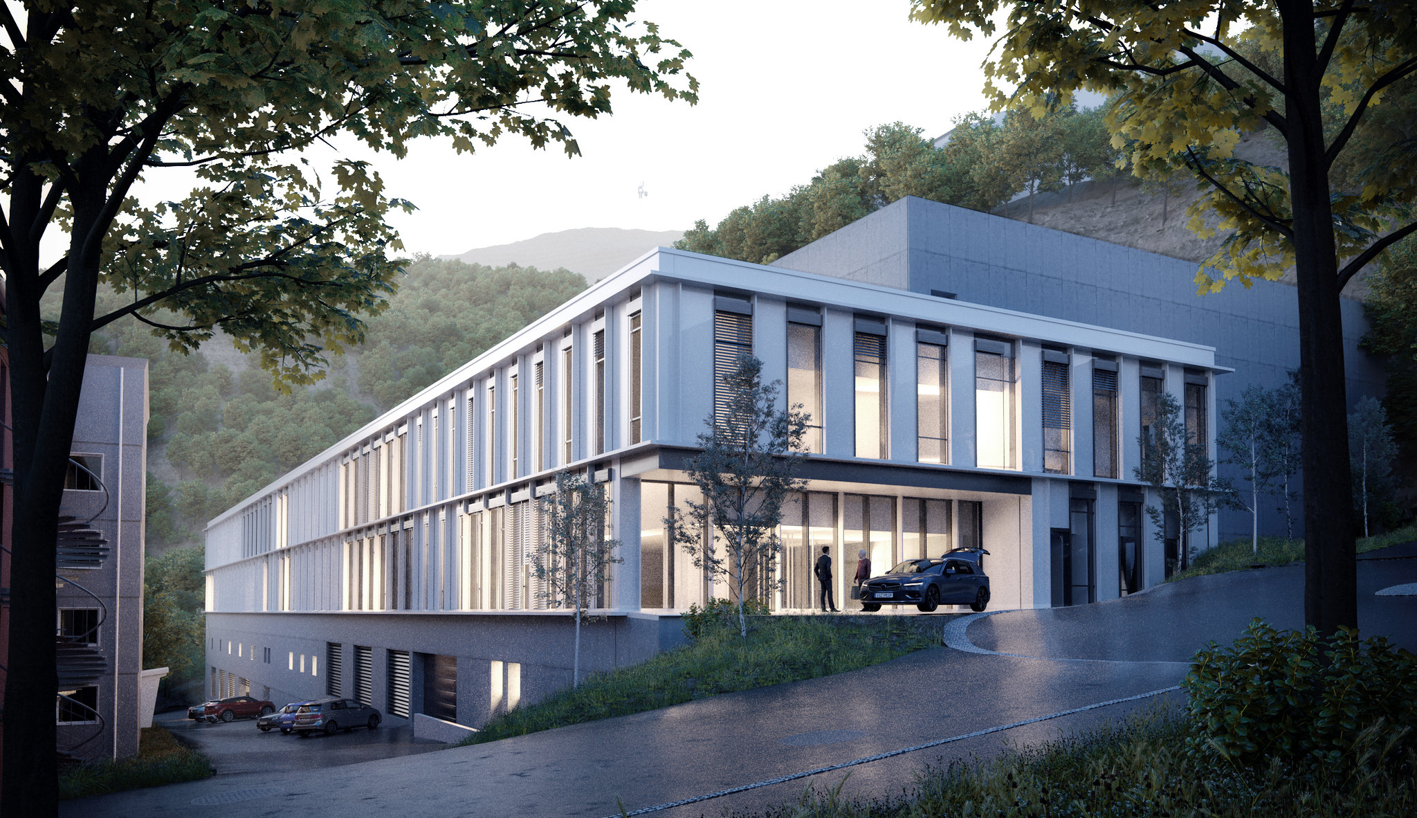 En bygning med biler parkert foran