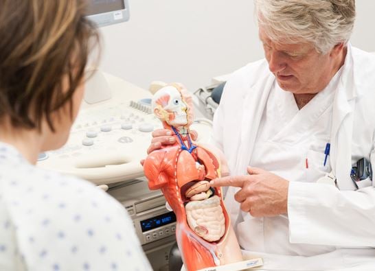 A doctor examining a baby