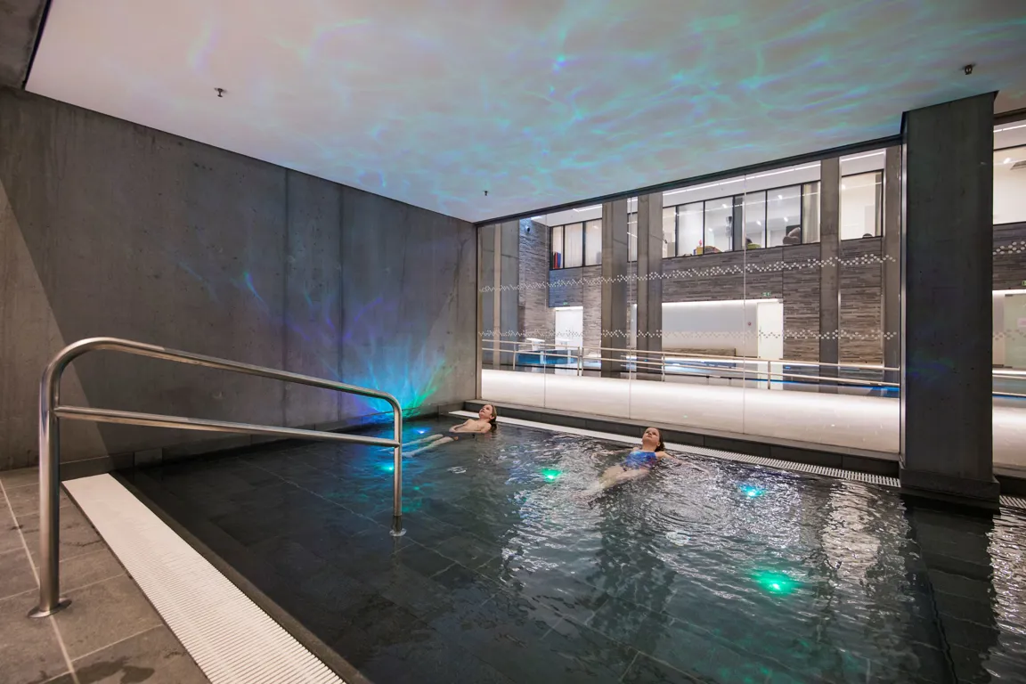 A couple of people in a swimming pool