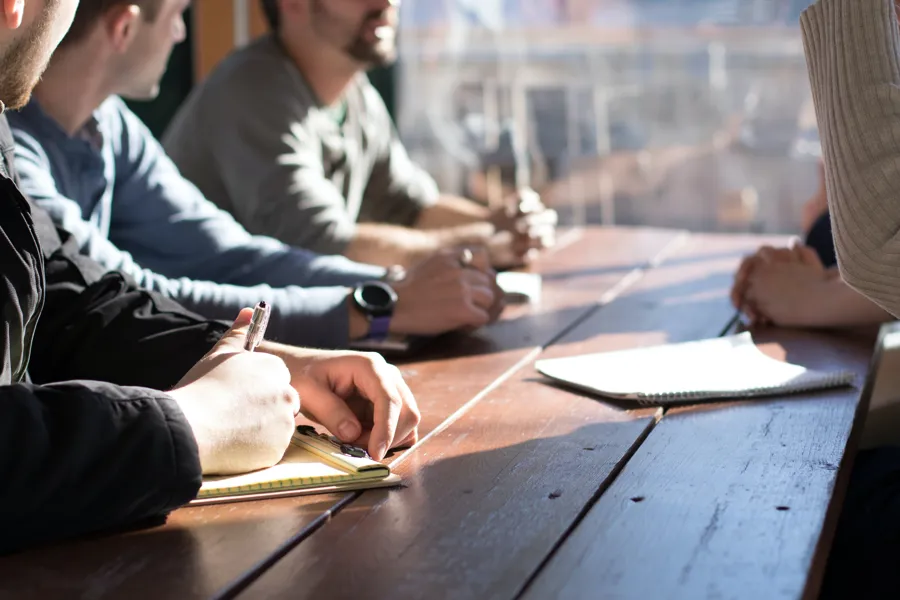 A group of people sitting at a table