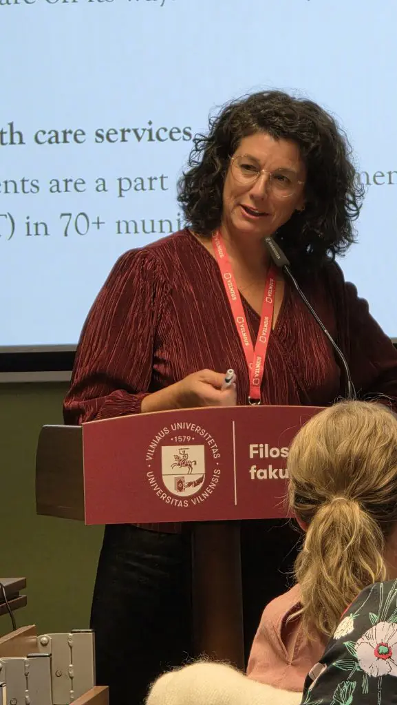 A woman speaking at a podium