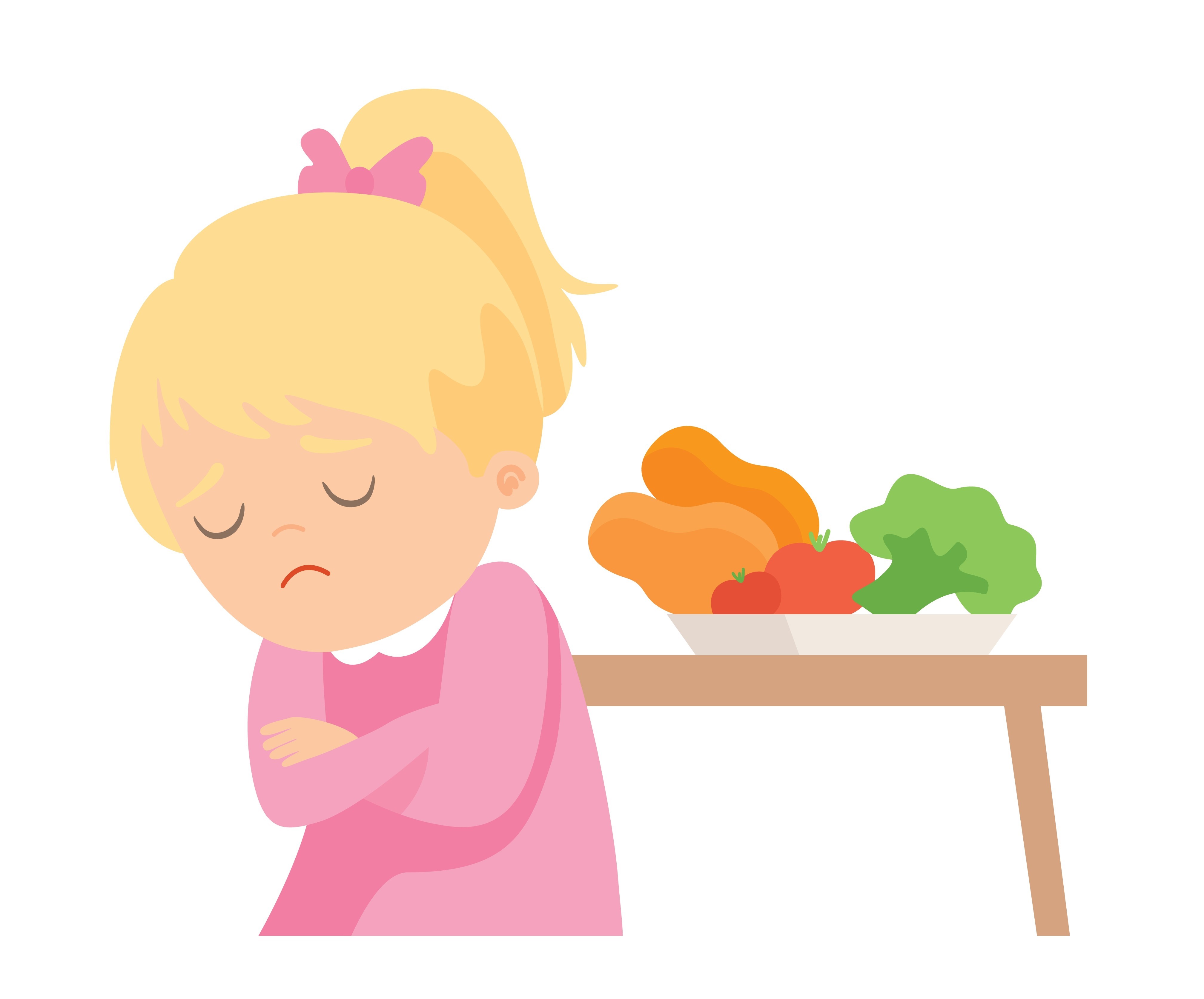 Eit barn som ikkje vil ete maten som står på bordet.