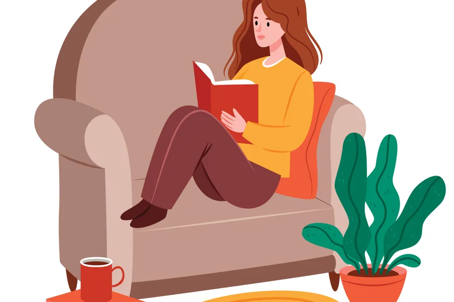 En person som sitter på en stol